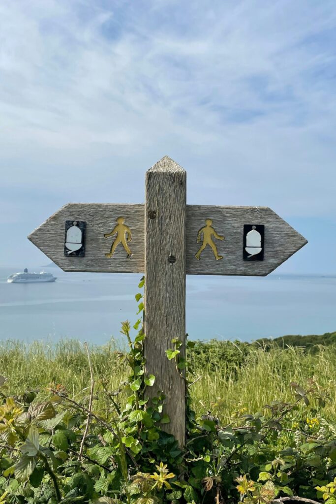 wooden sign pointing in different directions